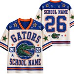 Custom Florida Gators themed sports jersey shown from both front and back views. The jersey features a distressed cream base with royal blue and orange accents, a green alligator logo, and customizable text fields for 'GATORS', 'SCHOOL NAME', and numbers.