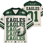 Front and back views of a Philadelphia Eagles themed sports jersey. The jersey features a cream-colored mesh body with green and black graphics, including the team name 'EAGLES', a large eagle head illustration, and the number '01' on the back.