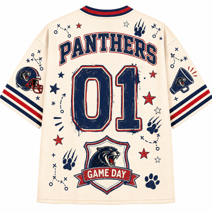 A cream-colored short-sleeve jersey shown from the back, featuring 'PANTHERS' and '01' in distressed navy blue with red outlines. The design includes a Panthers head crest with 'GAME DAY' banner, paw prints, stars, and football-themed graphics on the sleeves.
