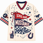 A cream-colored athletic jersey with navy and red trim, featuring a large 'School Name Mustangs Game Day' graphic with stars, horseshoes, and football-themed illustrations.