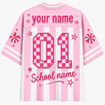 A pink and white striped short-sleeve t-shirt shown from the back, featuring customizable text that reads 'your name' and 'School name' along with a large pink checkerboard '01' and decorative stars.
