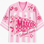 A pink and white striped V-neck athletic-style shirt with a large front graphic reading 'MASCOT' and 'School name,' decorated with bows, stars, candy canes, and foam-ball motifs on a light gray background.