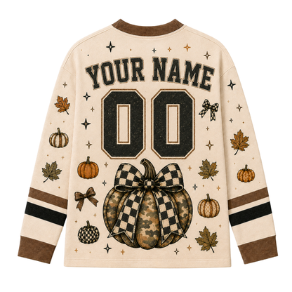 Back view of the customizable Chaotic Club long sleeve jersey showcasing 'YOUR NAME' typography above a distressed black athletic number 00 with a camo pumpkin below.