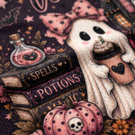 Close-up of a Halloween-themed fabric print featuring a ghost holding a drink cup, stacked books labeled Spells and Potions, a potion bottle, pumpkins, stars, and a dark purple background.