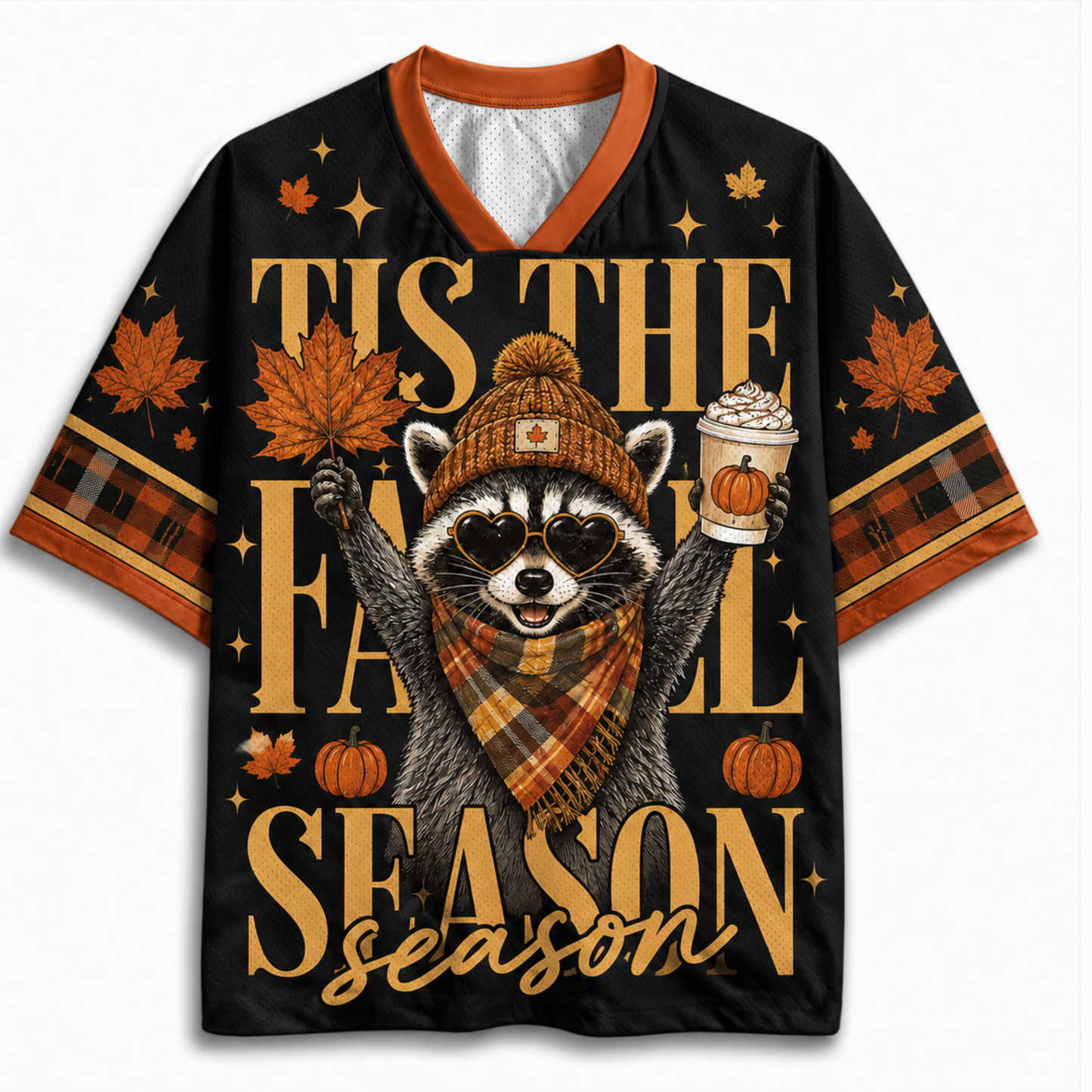 A black short-sleeve V-neck t-shirt with orange trim, featuring a festive autumn graphic of a raccoon in a beanie and scarf holding a pumpkin and a hot drink, surrounded by maple leaves, pumpkins, and the text 'TIS THE FALL SEASON'.