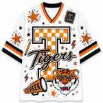 A white short-sleeve V-neck jersey with orange and black stripes on the sleeves, featuring a large orange and black checkered 'T' with 'Tigers' script across the front, plus a tiger face, megaphone, stars, and a 'Back to School' notebook graphic.