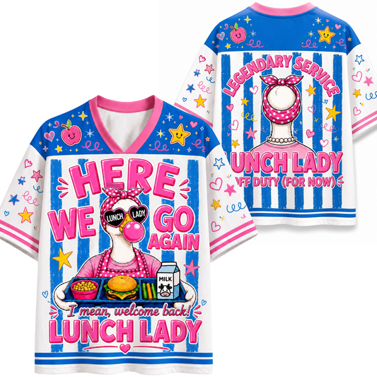 A white short-sleeve V-neck t-shirt with a colorful, cartoonish 'Lunch Lady' graphic on the front, shown alongside the back view of the same shirt. The design features a pink and blue striped background with stars, hearts, and a cartoon character wearing a pink bow and glasses.