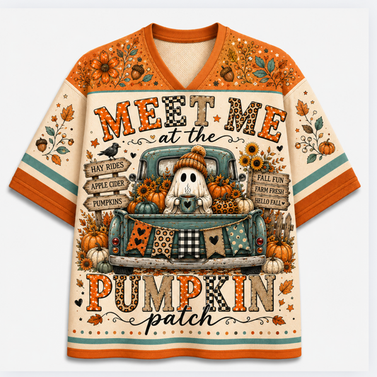 Front view of the cream varsity jersey displaying 'MEET ME at the PUMPKIN patch' text with a cozy ghost sitting in a vintage teal truck full of pumpkins.