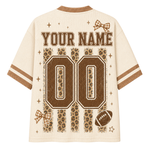 Back view of Chaotic Club Football Mesh Jersey displaying customizable player name, leopard-backed varsity sports number, and mini gingham bows.