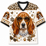 A short-sleeve V-neck t-shirt featuring a detailed graphic of a beagle dog wearing leopard-print sunglasses and a rhinestone collar, surrounded by gold stars, hearts, paw prints, and leopard-print patterns on a white background.