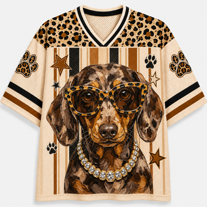 Front view of the cream varsity jersey displaying a swag Dachshund wearing leopard-frame sunglasses, a sparkling diamond necklace, and vertical stripes.