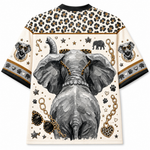 A short-sleeve crewneck t-shirt featuring a detailed graphic print of an elephant's rear, decorated with gold chains, sunglasses, paw prints, and leopard print patterns on the shoulders and sleeves.
