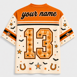 Custom short-sleeve athletic jersey shown from the back, featuring an orange yoke, cream sleeves, and a large orange number 13 with stars, horseshoes, and bats. The top has placeholder text reading 'your name'.