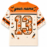 Back view of the customizable Chaotic Club Halloween jersey showcasing 'your name' text above a large plaid and leopard patterned athletic number 13 with paw prints.