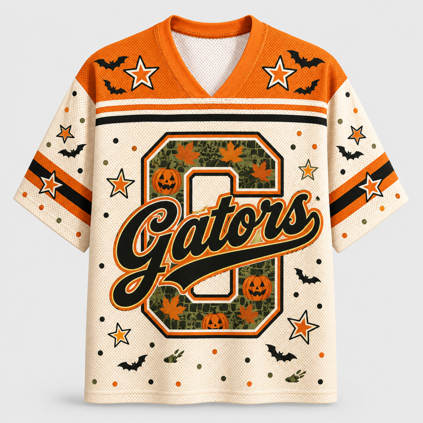 A short-sleeve football-style jersey with a Halloween theme, featuring an orange collar and shoulders, cream body, and a large 'G' on the front decorated with pumpkins, maple leaves, and bats.