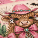 Macro close-up shot of the graphic on mesh fabric, focusing on the turquoise gem details, textured cow fur, pink coquette ribbon, and leopard print pumpkin.