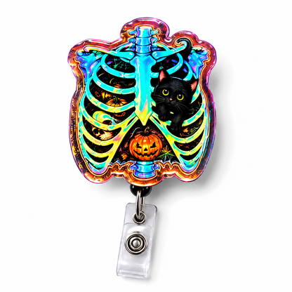 A Halloween-themed retractable badge reel featuring a colorful, iridescent rib cage design with a black cat and jack-o'-lantern, attached to a clear plastic reel on a white background.