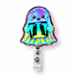 A ghost-shaped retractable badge reel with a holographic rainbow finish and a cute smiling face holding an X-ray graphic, attached to a clear plastic clip on a white background.