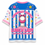 A short-sleeve t-shirt with a colorful graphic print featuring a cartoon character labeled 'LUNCH LADY' and the text 'LEGENDARY SERVICE OFF DUTY (FOR NOW)'. The shirt has blue and white vertical stripes on the front, a blue yoke with pink collar and star/heart prints, and white sleeves with pink and blue accents.