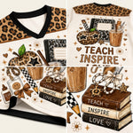 A detailed product collage displaying the black ribbed V-neck collar, neat sleeve hems with brown heart accents, and the rich color sublimation printing on mesh.