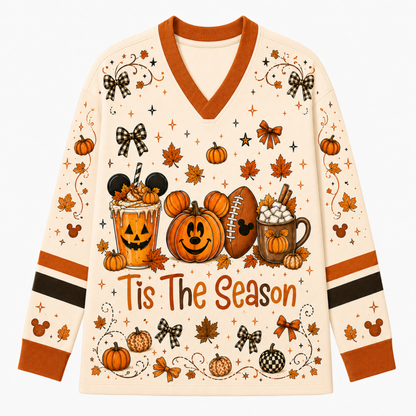 Front view of the cream long sleeve jersey displaying Mickey Mouse pumpkins, iced pumpkin spice latte, football, hot cocoa, and Tis The Season typography.