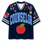 Front view of the navy blue varsity jersey displaying 'COUNSELOR' in blue gingham pattern above a red stitched apple and school supply doodles.