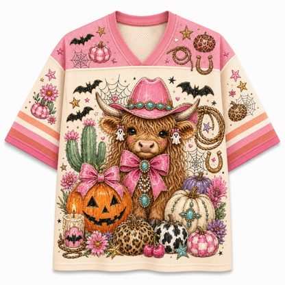 Front view of the cream white western jersey showcasing a fluffy highland cow wearing a pink cowgirl hat and ribbon bow next to carved jack-o-lanterns.