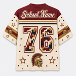 Customizable short-sleeve jersey shirt shown from the back, featuring a maroon upper chest, cream sleeves and body, a large camouflage-filled number 76, 'School Name' text across the shoulders, stars, dots, and a Spartan helmet graphic near the lower back.