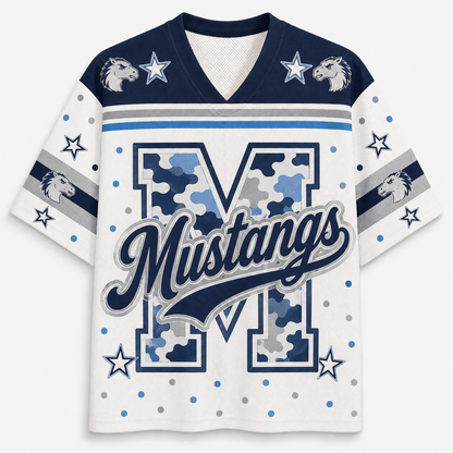 A white and navy blue athletic jersey-style shirt with a large camouflage-patterned letter M, the word Mustangs across the front, star and dot graphics, and horse head motifs on the shoulders and sleeves.