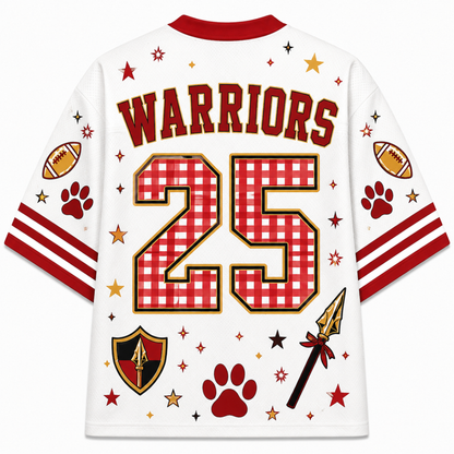 White short-sleeve sports jersey shown from the back with red collar and sleeve trim. The back features the word WARRIORS in large red letters, the number 25 in red-and-white gingham with a gold outline, and decorative football, paw prints, stars, and a shield motif in red, gold, and black.