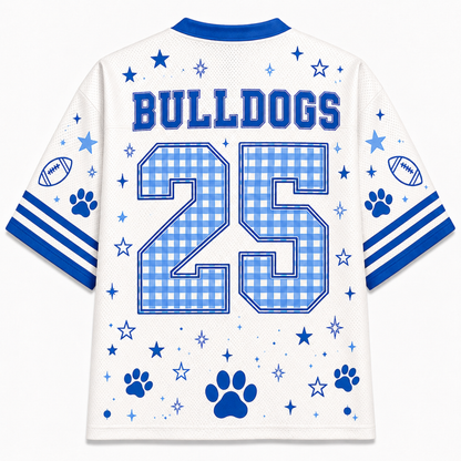 White mesh football-style jersey shown from the back with blue trim, the word BULLDOGS across the shoulders, the number 25 in a blue gingham pattern, stars, paw prints, football motifs, and blue stripes on the sleeves.