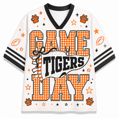 A white mesh short-sleeve t-shirt with a black V-neck collar and sleeve stripes, featuring a 'GAME TIGERS DAY' graphic print in orange and black with paw prints and stars.