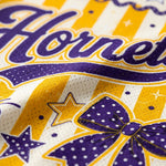 Macro close-up shot of the sublimation printing on the Hornets jersey, emphasizing the breathable mesh texture, script font, and purple polka-dot bow.