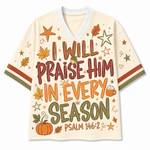 Front view of the cream varsity mesh jersey displaying colorful hand-lettered text 'I Will Praise Him In Every Season Psalm 146:2' surrounded by pumpkins, acorns, and fall leaves.