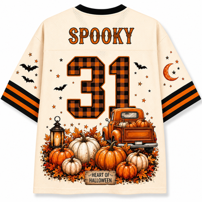 Back view of a cream mesh sports jersey with 'SPOOKY' and the number 31 in orange and black buffalo plaid, decorated with a fall harvest graphic including pumpkins, an orange pickup truck, bats, stars, and a crescent moon.