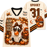 A Halloween-themed V-neck t-shirt shown from both the front and back. The shirt has a cream base with black and orange accents, featuring a cartoon ghost wearing a plaid bow tie and heart-shaped sunglasses, surrounded by pumpkins, autumn leaves, a pickup truck, and text that reads 'HELLO FALL', 'COZY DAYS', 'WARM DRINKS', and 'GOOD VIBES'.