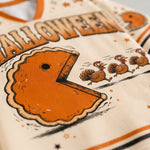 Macro close-up shot of the graphic print on mesh, focusing on the high-definition textures of the pumpkin pie crust, cartoon running turkeys, and star accents.