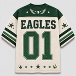 A vintage-style athletic jersey shown flat against a light gray background. The jersey is cream-colored with dark green mesh panels on the shoulders, collar, and sleeves, featuring green and white stripes on the sleeves.