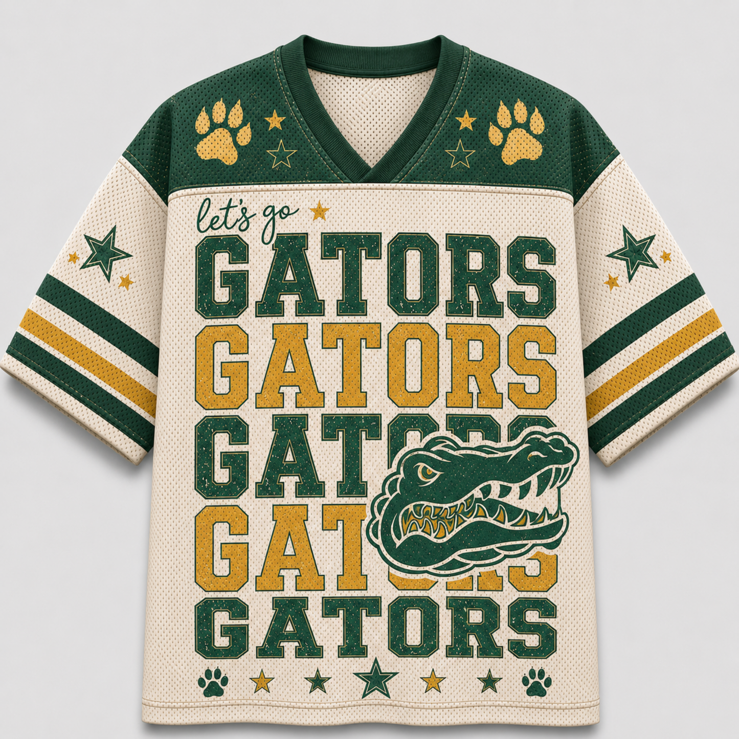 A short-sleeve V-neck football jersey with a cream mesh body, dark green shoulders and collar, and gold/yellow accents. The front reads 'let's go GATORS GATORS GATORS' in large block letters, with a large alligator graphic and paw prints and stars on the shoulders and sleeves.