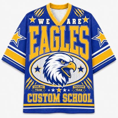 A royal blue and yellow short-sleeve V-neck jersey-style shirt with a large eagle head graphic and the words 'WE ARE EAGLES' and 'CUSTOM SCHOOL' on the front, shown on a plain light background.