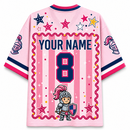 A pink personalized soccer jersey with a medieval theme, featuring a cartoon knight graphic, pink and navy vertical stripes, a wavy pink border, and customizable text 'YOUR NAME' and number '8' on the back.