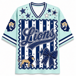 A light blue and navy blue short-sleeve V-neck jersey-style shirt with 'Lions' script across the front, star motifs, lion head graphics on the sleeves, and a large bow graphic near the hem, shown on a plain white background.