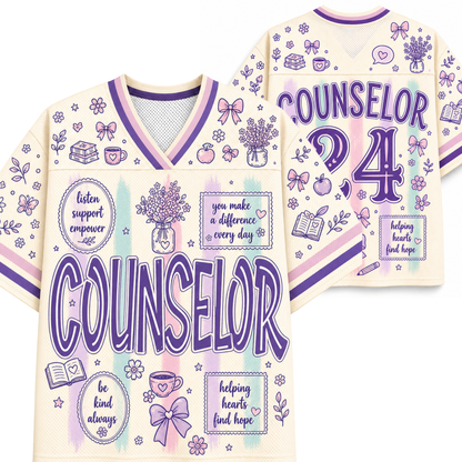 A cream-colored athletic-style counselor jersey shown from both the front and back. The jersey features purple and lavender graphics, including the word 'COUNSELOR' in large letters, the number '24', and various decorative illustrations like bows, flowers, books, and hearts.