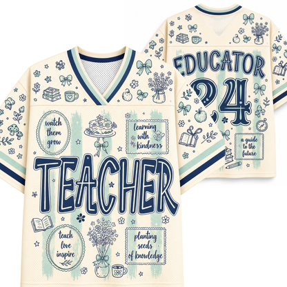 A cream-colored V-neck jersey-style shirt shown from the front and back, decorated with navy blue text reading 'TEACHER' and 'EDUCATOR 24' and surrounded by small school-themed illustrations such as books, flowers, bows, and chalkboard drawings.