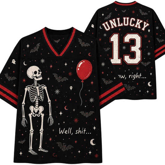 Black V-neck t-shirt with a red and white Halloween theme, featuring a skeleton graphic, bats, stars, crescent moons, and a red balloon. The front reads 'Well, shit.