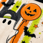 Macro close-up shot of the graphic print on mesh fabric, focusing on the high-definition details of the ghost's snapback cap, pumpkin balloon, candy corn, and brushstrokes.