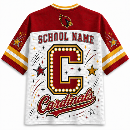 A customizable Cardinals school spirit jersey shown from the back, featuring a red and white design with a large marquee-style letter 'C', 'SCHOOL NAME' text, and 'Cardinals' script. The collar and sleeve cuffs have red, white, and yellow stripes, and the back features a red cardinal logo.