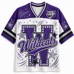A purple and white short-sleeve athletic jersey with 'Wildcats' lettering, a large 'W' graphic, stars, sparkles, and a wildcat mascot logo on the chest, shown on a plain light background.
