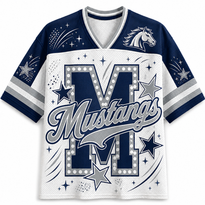 A short-sleeve V-neck athletic jersey with a white and navy blue design. The front features a large letter 'M' outlined with stars, the word 'Mustangs' in script across the center, a horse head logo on the upper right chest, and star/firework graphics on the sleeves and shoulders.