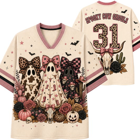 A cream-colored v-neck t-shirt with a detailed Halloween graphic featuring three ghosts, a cow skull, pumpkins, cacti, and bats, shown in both front and back views. The back features the text 'SPOOKY COW GOULDS' and the number '31'.